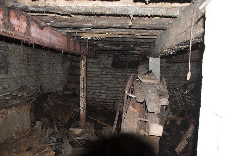 Basement detail showing decayed floor joists