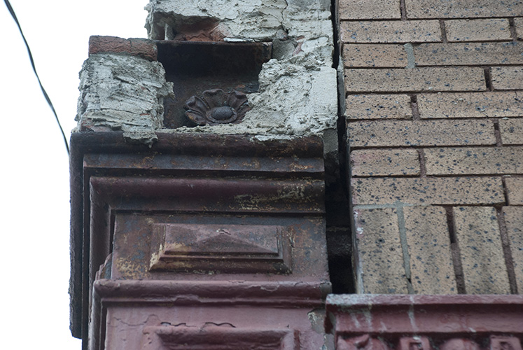 Original store-front iron rosette